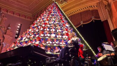 Michigan high school choir belts out holiday tunes from a towering Christmas tree