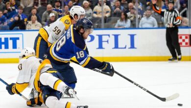 Thomas scores twice and the Blues beat the Predators 7-4