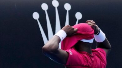 Frances Tiafoe picks up a tough victory after throwing up at the Australian Open