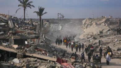 Palestinians trek across rubble to return to their homes as Gaza ceasefire takes hold