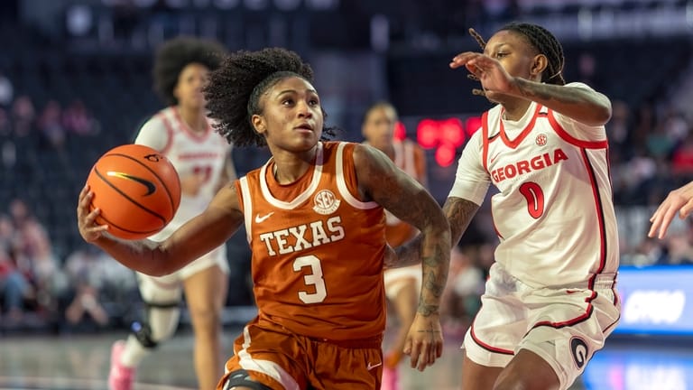 Texas celebrates first No. 1 ranking in 21 years by leaning on defense to beat Georgia 57-26