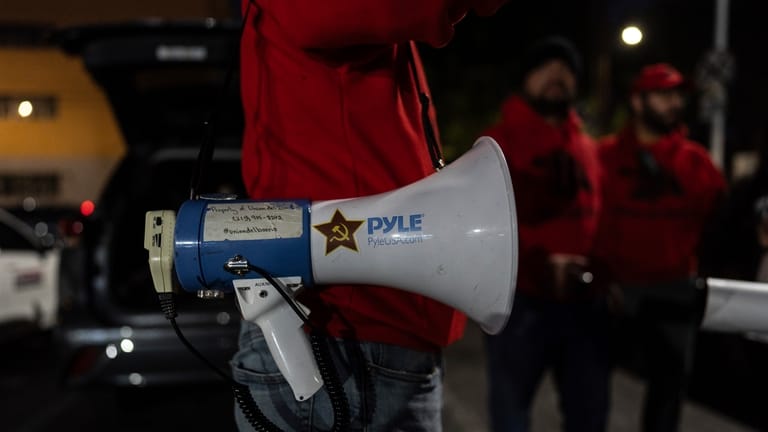 Volunteers use bullhorns and sirens to warn immigrants when ICE is in their area