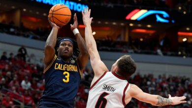 Louisville’s Reyne Smith leaves game with lower leg injury in game against Cal