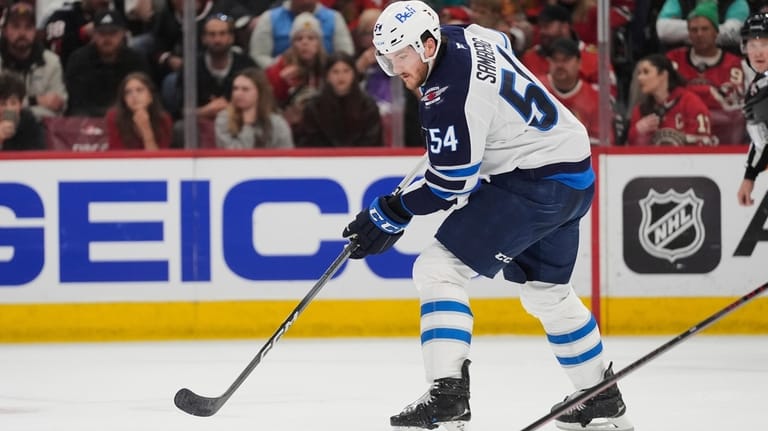 Connor stars as Jets clinch Central Division title with shootout victory over Blackhawks Connor stars as Jets clinch Central Division title with shootout victory over Blackhawks