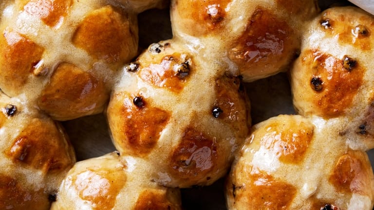 Bourbon-plumped currants enhance the flavor of hot cross buns for Easter Bourbon-plumped currants enhance the flavor of hot cross buns for Easter